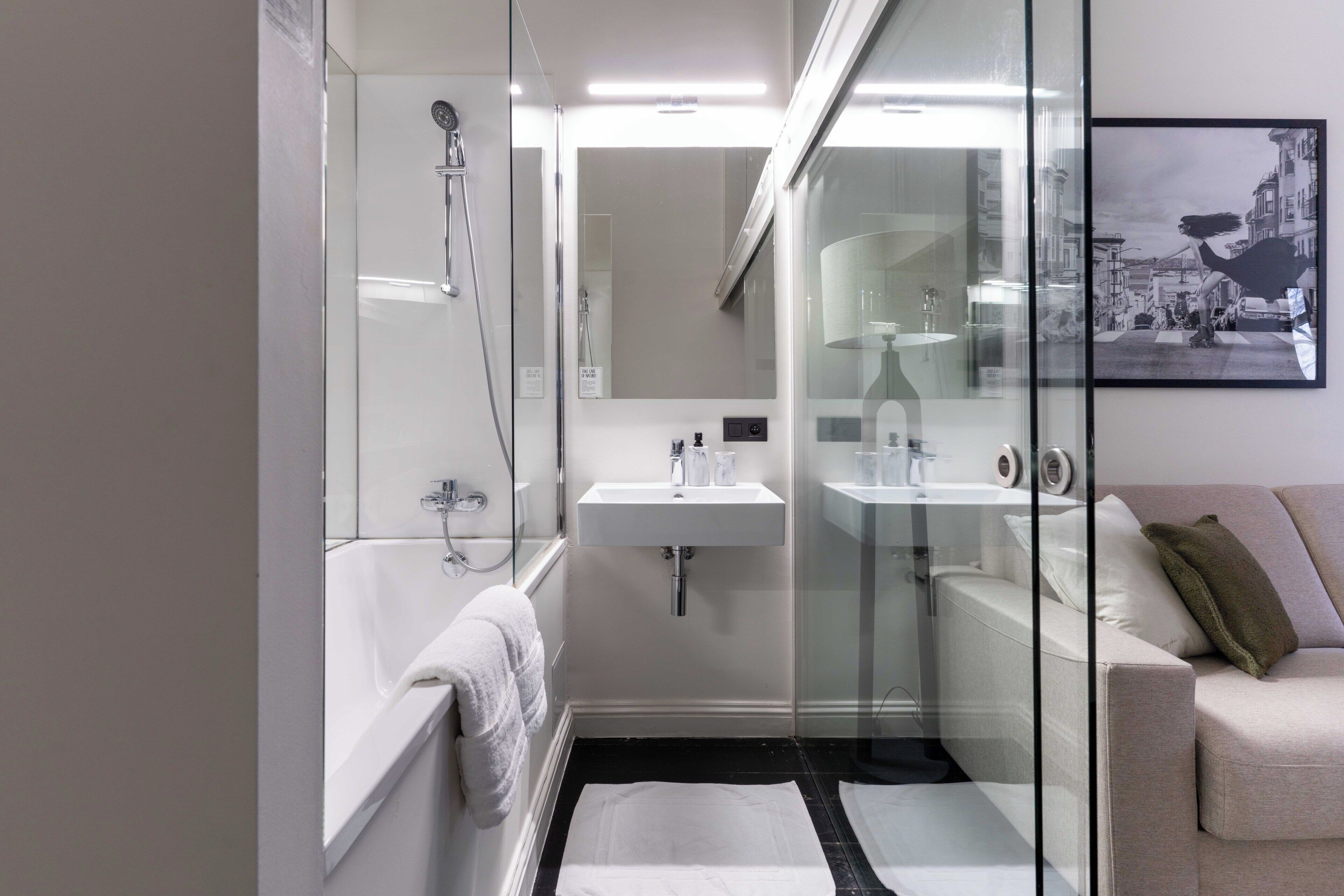 Double Room | Bathroom | Shower, hair dryer, bathrobes, towels