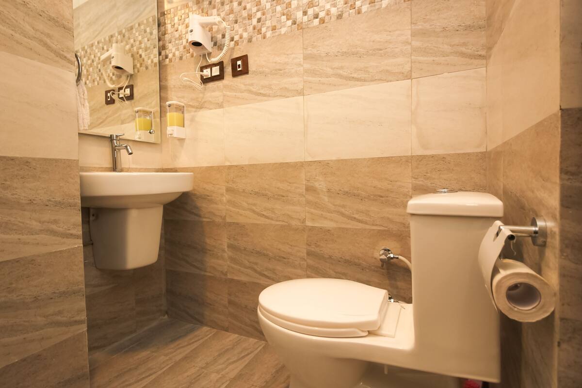 shower, rainfall showerhead, hair dryer, towels