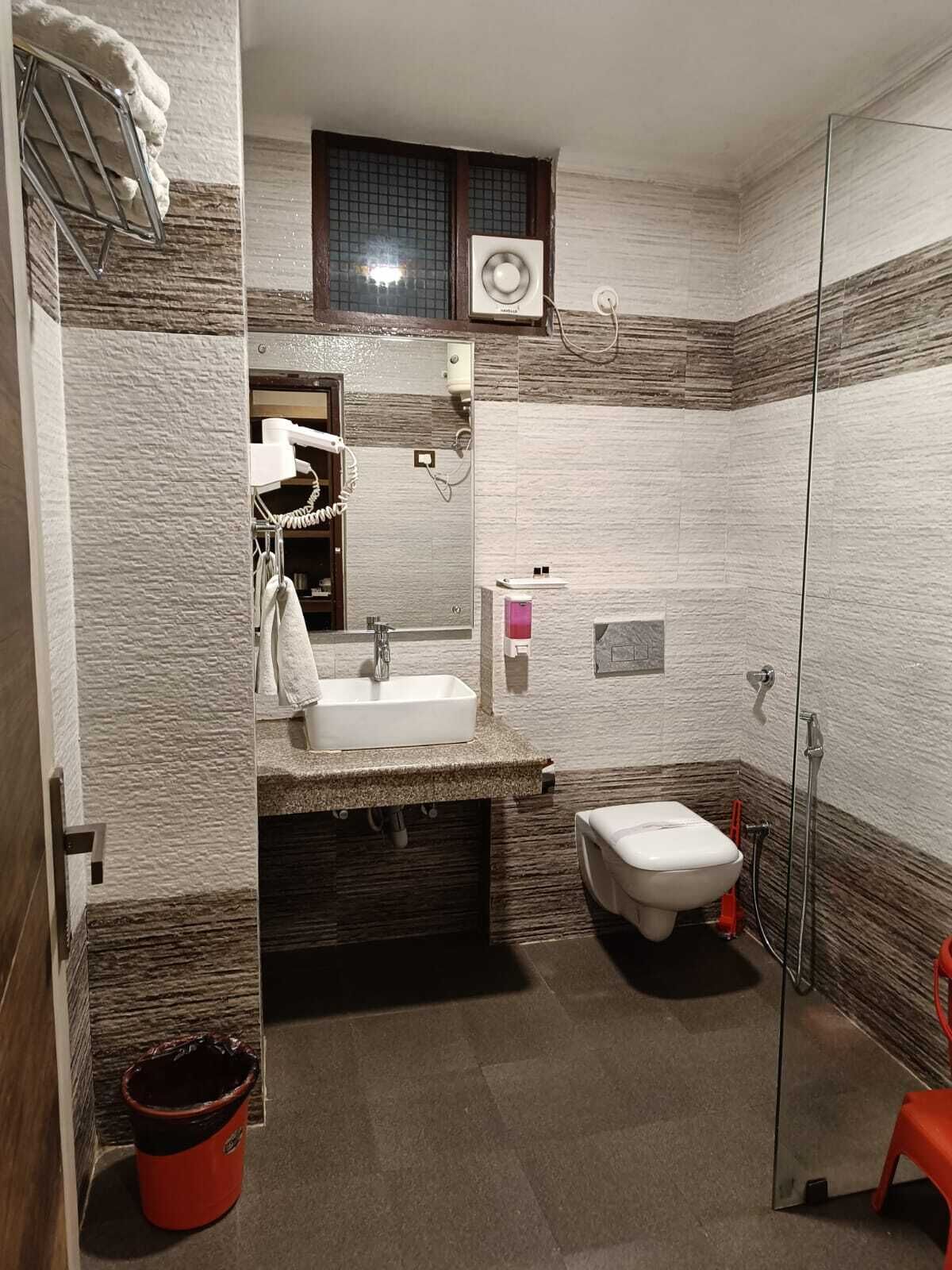 superior room | bathroom | shower, rainfall showerhead, hair dryer, towels