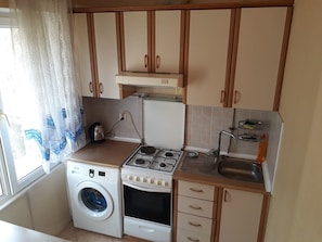 Apartment | Shared kitchen facilities | Fridge, stovetop, electric kettle, cookware/dishes/utensils