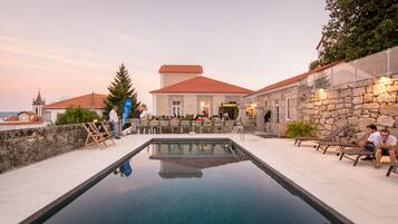 Seasonal outdoor pool, pool loungers