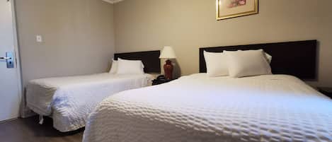 Premium bedding, pillow-top beds, desk, laptop workspace