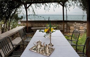 Outdoor dining - A fascinating Medioeval Tower on the borders of Lake Garda (Lazise)
