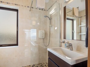 Combined shower/tub, hair dryer, towels, soap