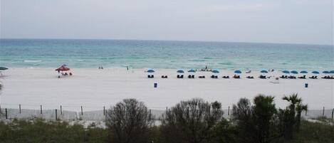 On the beach, sun-loungers