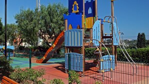 A playground with a slide, climbing structures, and a fenced area. - Panoramic seaview terrace overlooking Villefranche/Mer Old Town 10min walk Beach (Provence-Alpes-Côte-D’Azur)