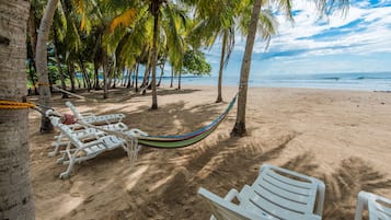 On the beach, sun loungers, beach towels