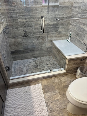 Combined shower/tub, hair dryer, towels, soap