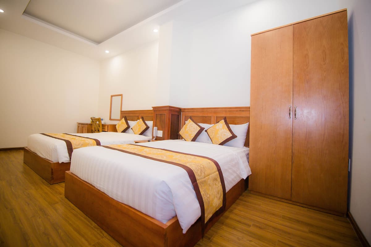 Standard Quadruple Room | Minibar, in-room safe, desk, soundproofing