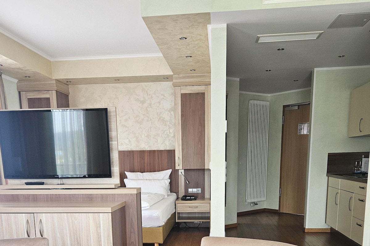 Exclusive Double Room | Living area | Flat-screen TV