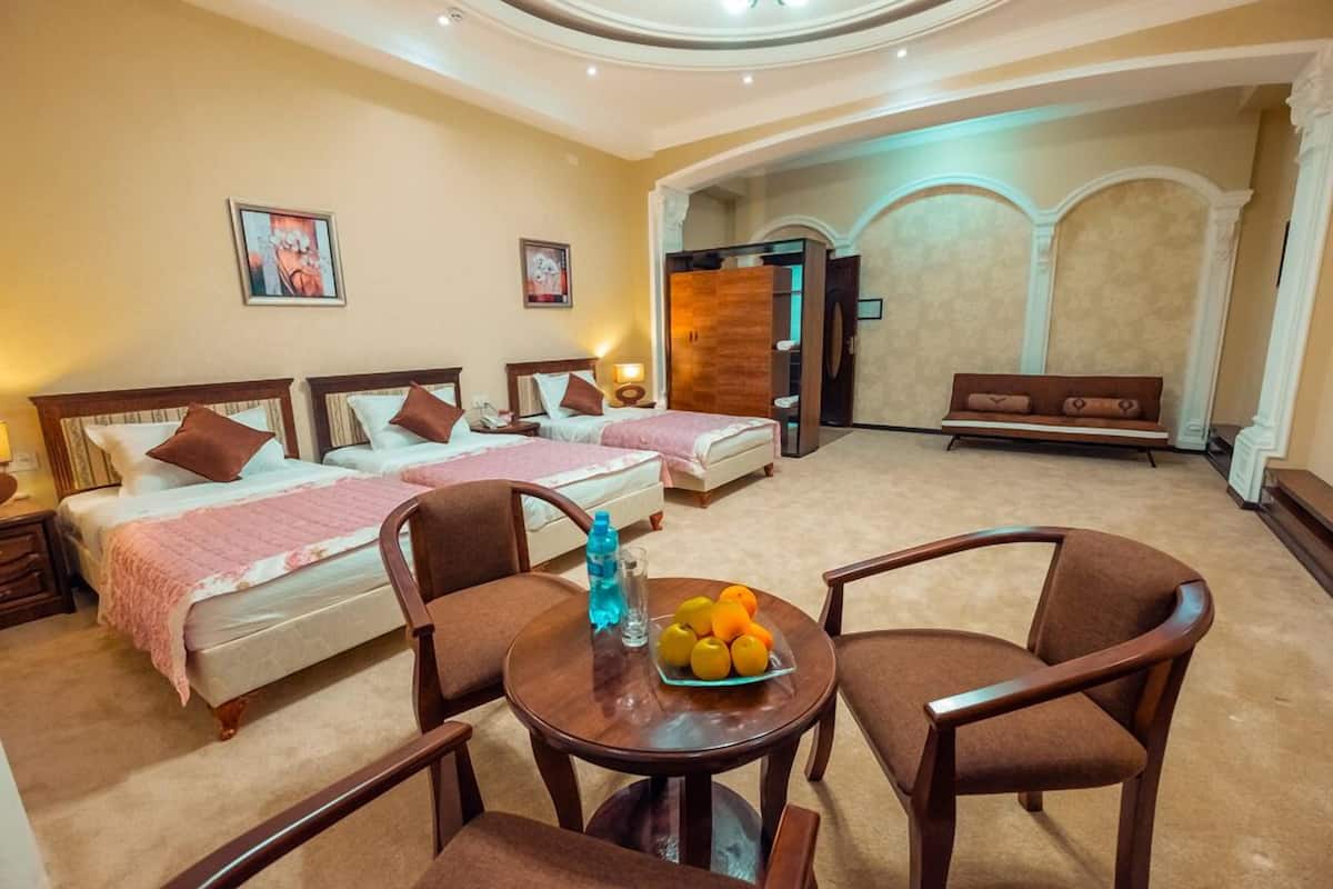 Deluxe Triple Room | Minibar, in-room safe, desk, iron/ironing board (on request)