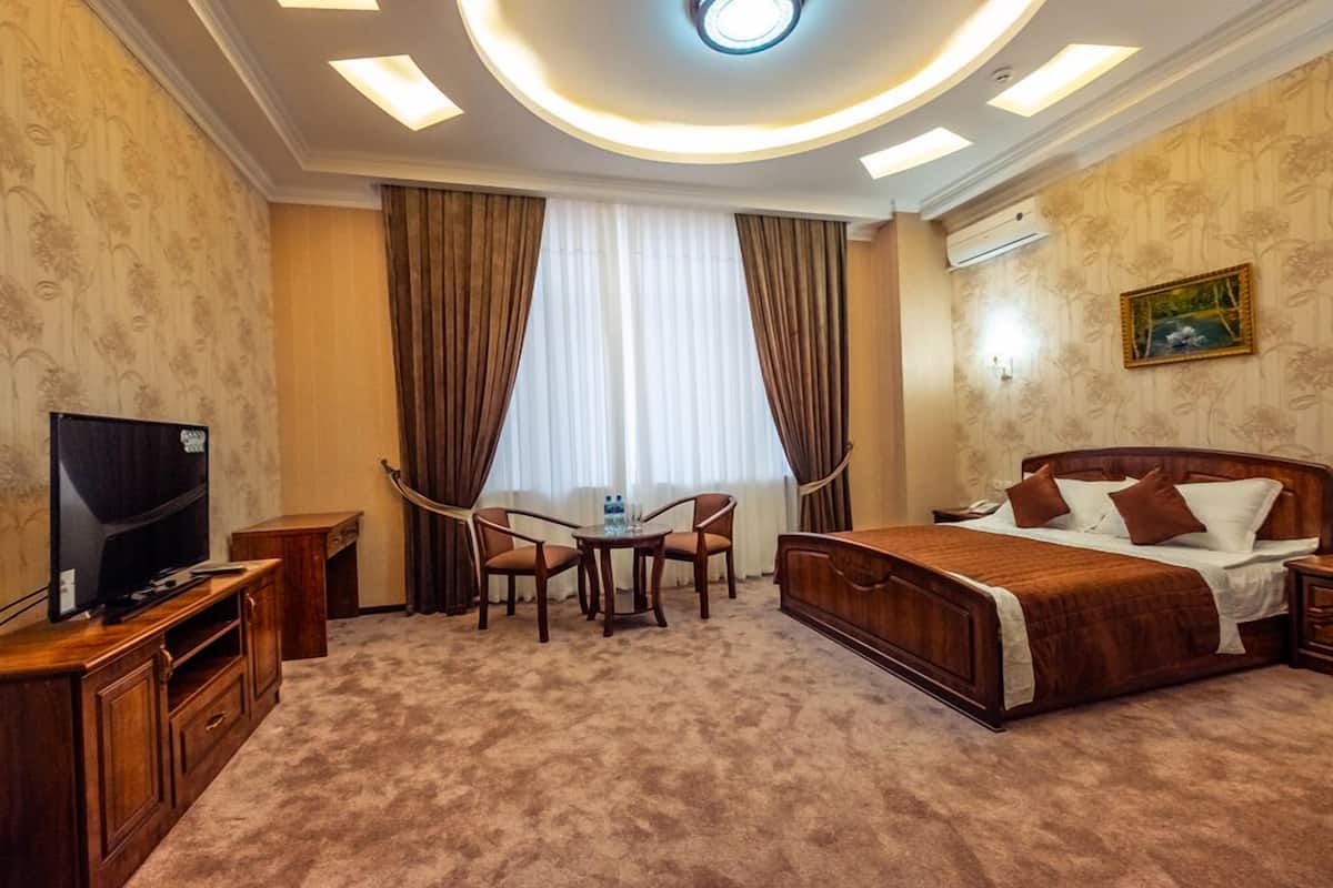 Deluxe Double Room | Minibar, in-room safe, desk, iron/ironing board (on request)