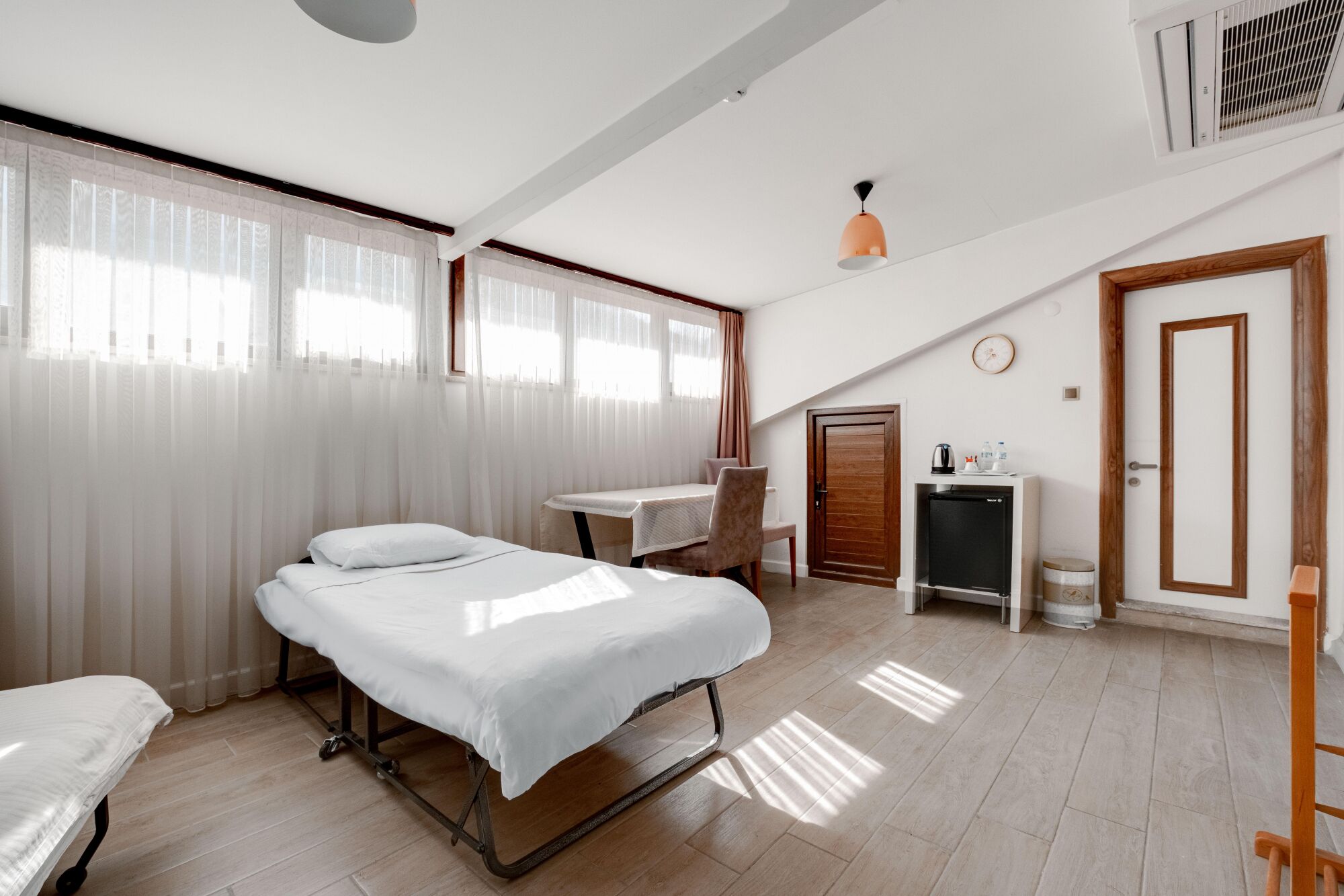 family double or twin room | minibar, desk, laptop workspace, iron/ironing board