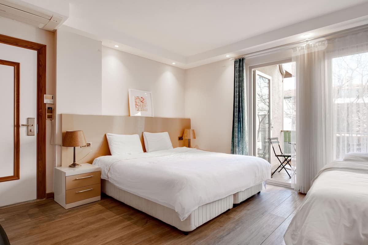 Standard Triple Room | Minibar, desk, laptop workspace, iron/ironing board