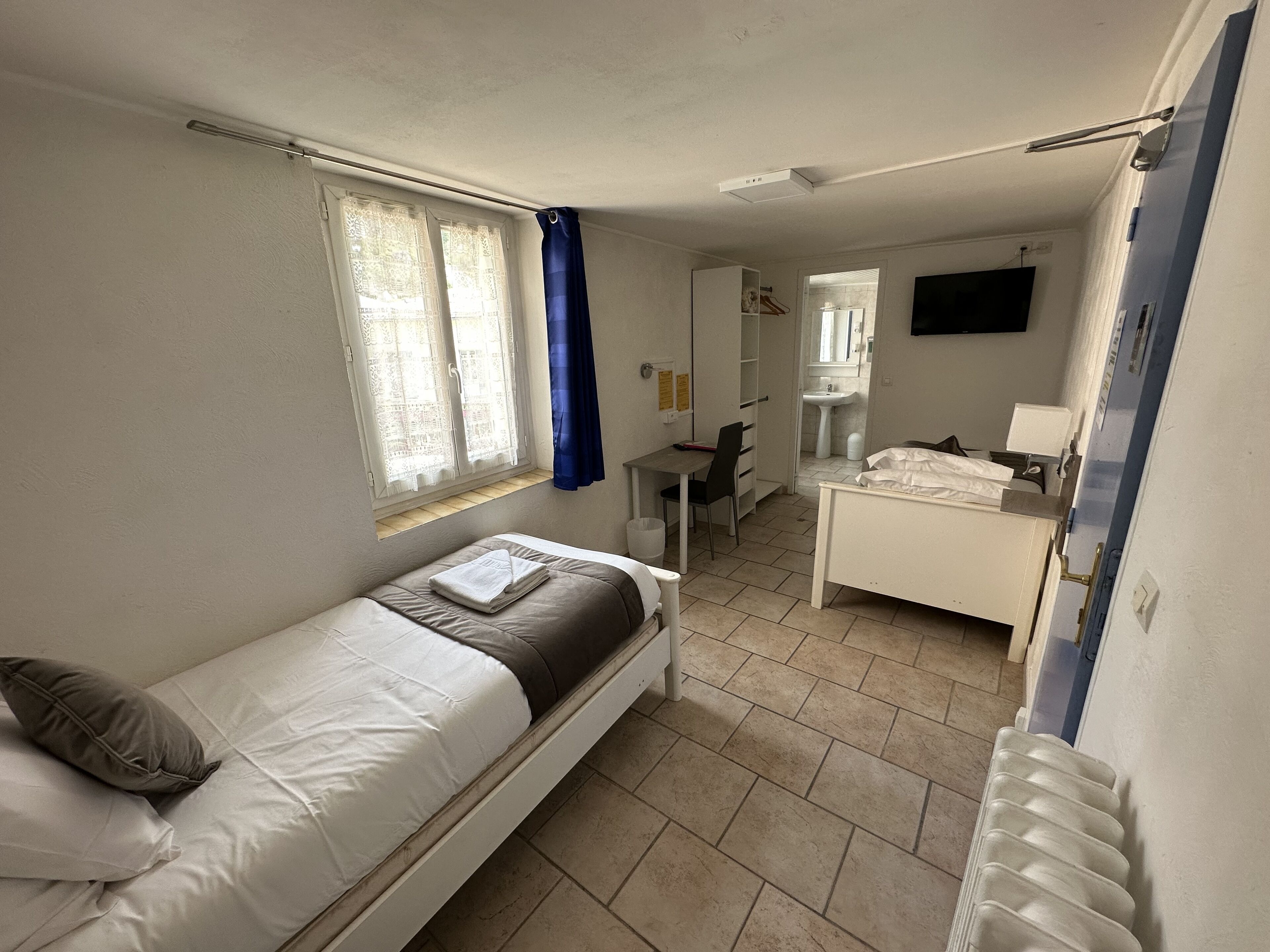 room with two separated beds | desk, laptop workspace, free wifi, bed sheets