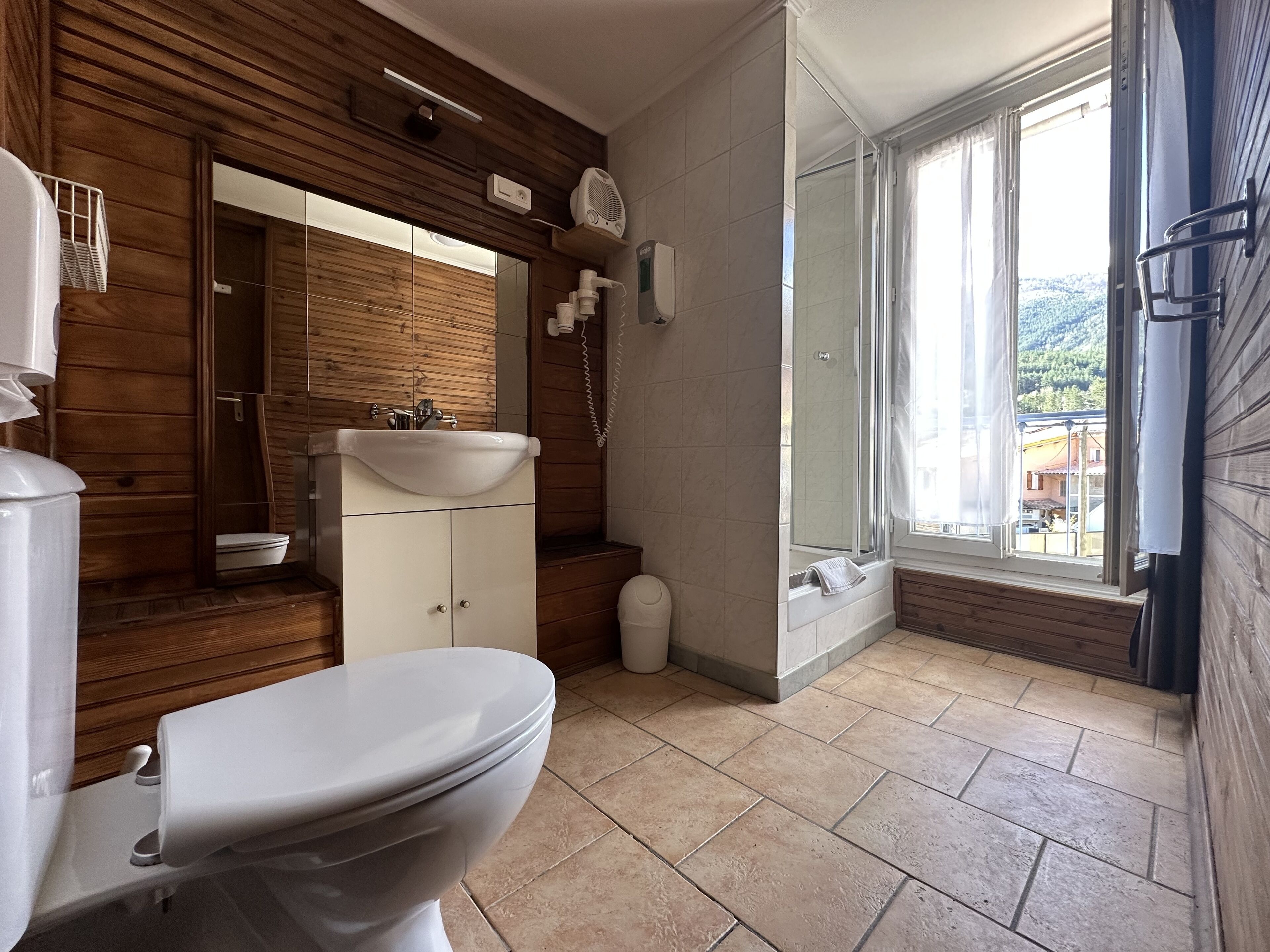 room with two separated beds | bathroom | shower, hair dryer, towels