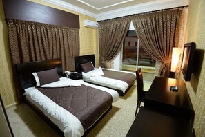 Twin Room, 2 Twin Beds | Minibar, blackout drapes, free WiFi, bed sheets