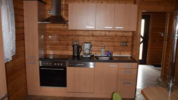 Fridge, stovetop, dishwasher, coffee/tea maker
