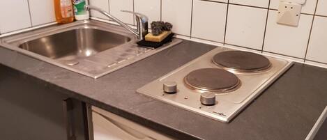 Fridge, microwave, stovetop, coffee/tea maker