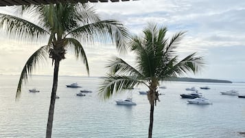 Signature Suite, Non Smoking, Ocean View | Down duvets, pillow-top beds, in-room safe, individually decorated