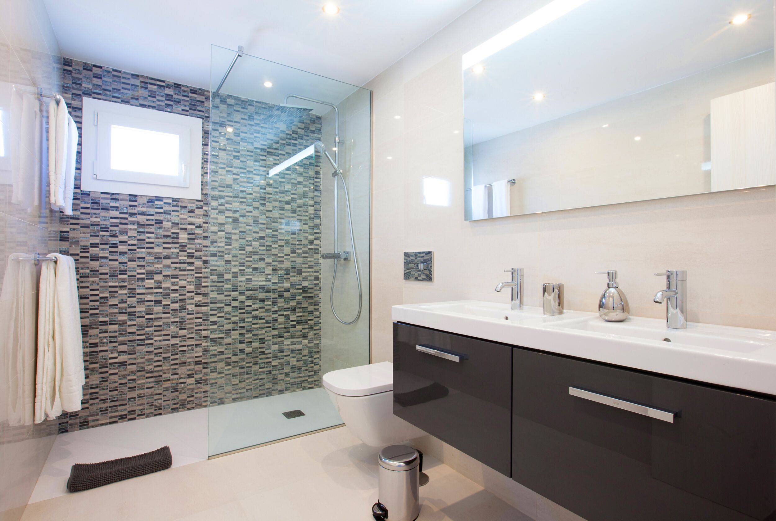 Shower, hair dryer, towels, toilet paper