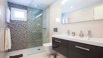 Shower, hair dryer, towels, toilet paper