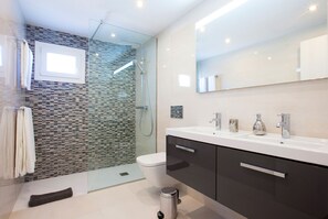 Shower, hair dryer, towels, toilet paper