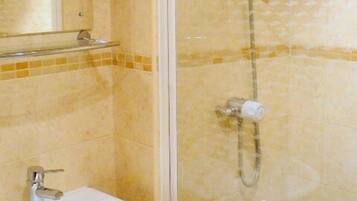 Combined shower/bathtub, hair dryer, towels, soap
