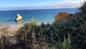 A coastal landscape with a rocky outcrop and a clear view of the sea. - Beautiful, Private Family Villa with Great Pool and access to Beaches, Mountains (Monte Canelas, Nr Alvor, District of Portimão)