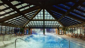 An indoor swimming pool with a high ceiling and large windows. - 1 Bedroom Luxury Villa Ski in/Ski out Park City Westgate Canyons Resort (Park City)