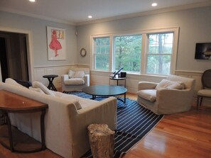 Smart TV, fireplace, video game console, table football