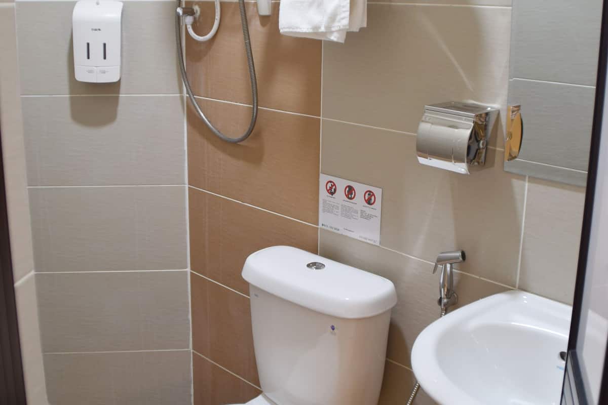 twin room (without window) | bathroom | shower, free toiletries, hair dryer, bidet