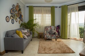 Signature Apartment, 2 Bedrooms | Living room | LCD TV
