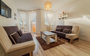 Apartamento (3a/11) | Área de estar | TV de tela plana