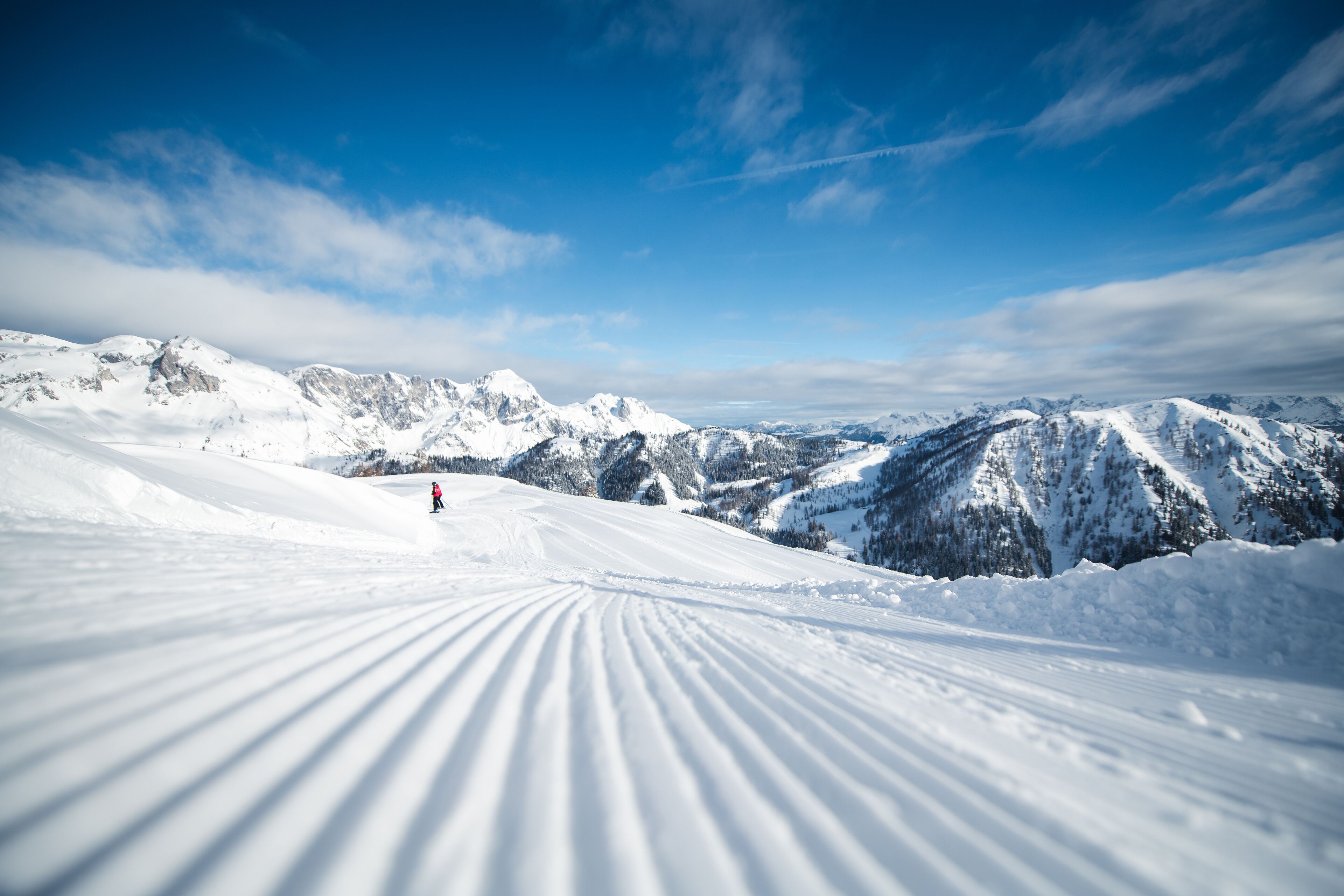 A snow-covered mountain landscape with a clear sky.