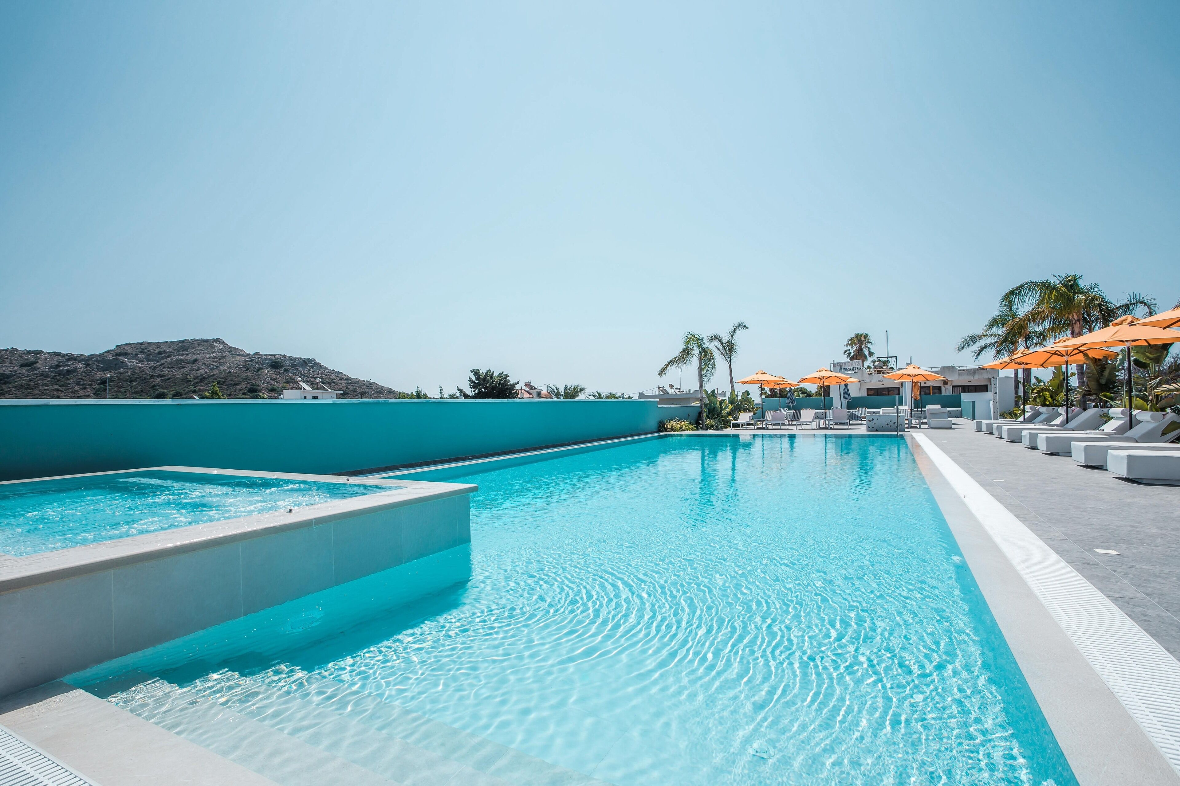 outdoor pool, open 8:00 am to 8:00 pm, pool umbrellas, pool loungers