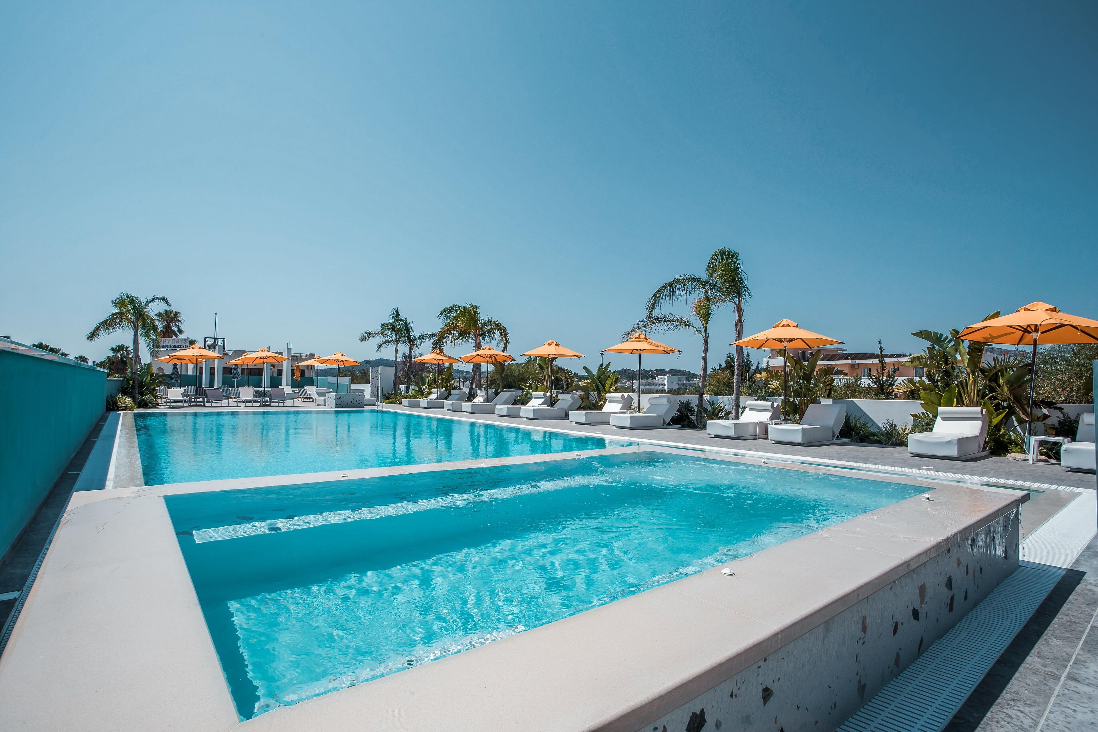 Outdoor pool, open 8:00 AM to 8:00 PM, pool umbrellas, pool loungers