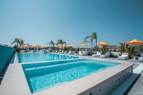 Outdoor pool, open 8:00 AM to 8:00 PM, pool umbrellas, sun loungers