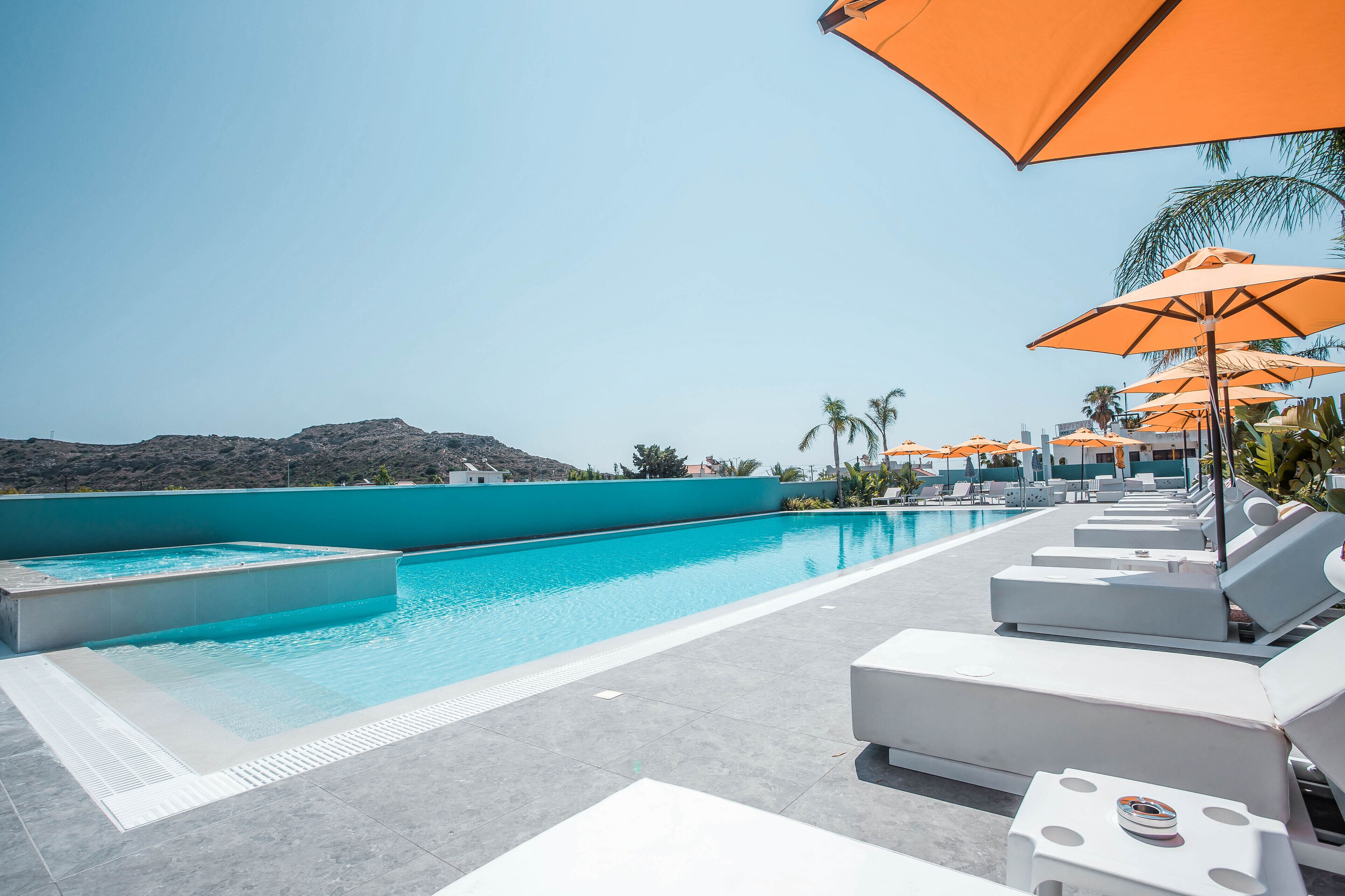 Outdoor pool, open 8:00 AM to 8:00 PM, pool umbrellas, sun loungers