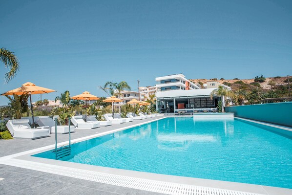 Outdoor pool, open 8:00 AM to 8:00 PM, pool umbrellas, pool loungers