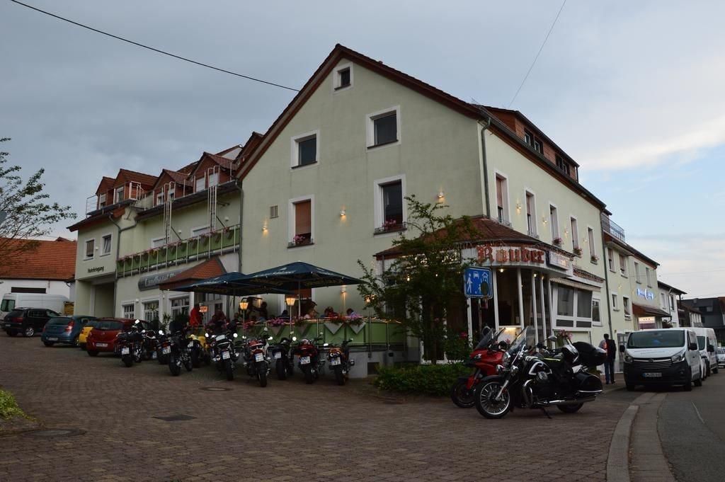 A building with a ground-floor bar and several parked motorcycles.