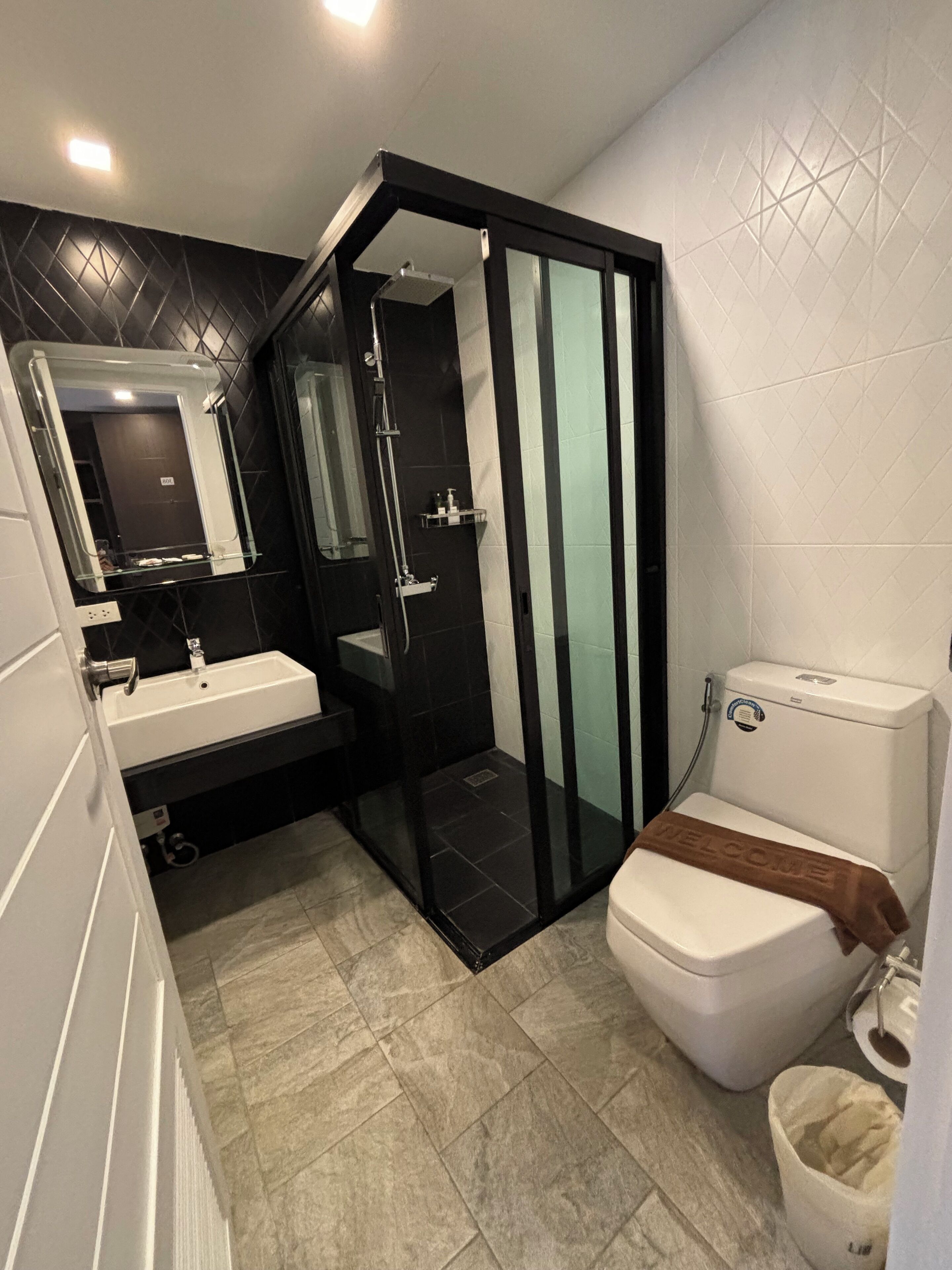 deluxe double room, 1 king bed, non smoking, no windows | bathroom | shower, rainfall showerhead, free toiletries, hair dryer