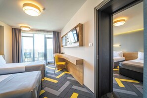 Family Room | Free minibar, desk, blackout drapes, soundproofing