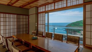 A traditional Japanese-style room with tatami flooring, a low table, and shoji screens. - Manazuru Marin (Manazuru)