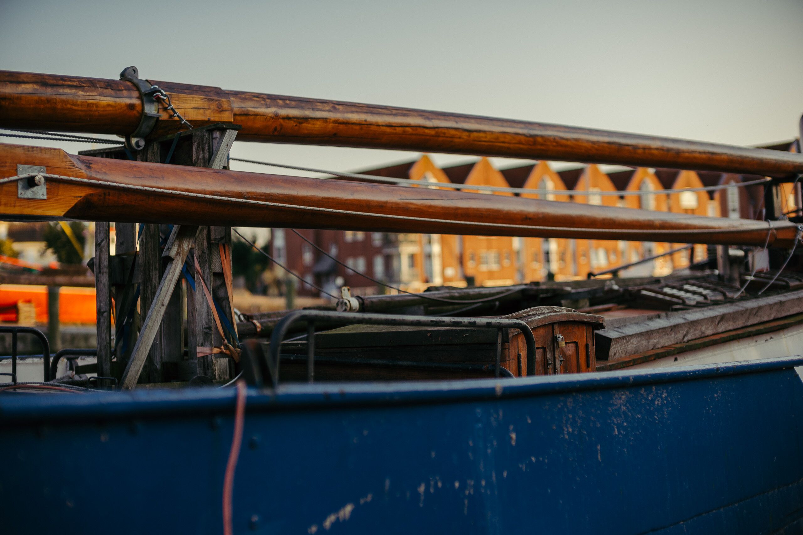 A close-up of a boat's wooden structure and metal components.