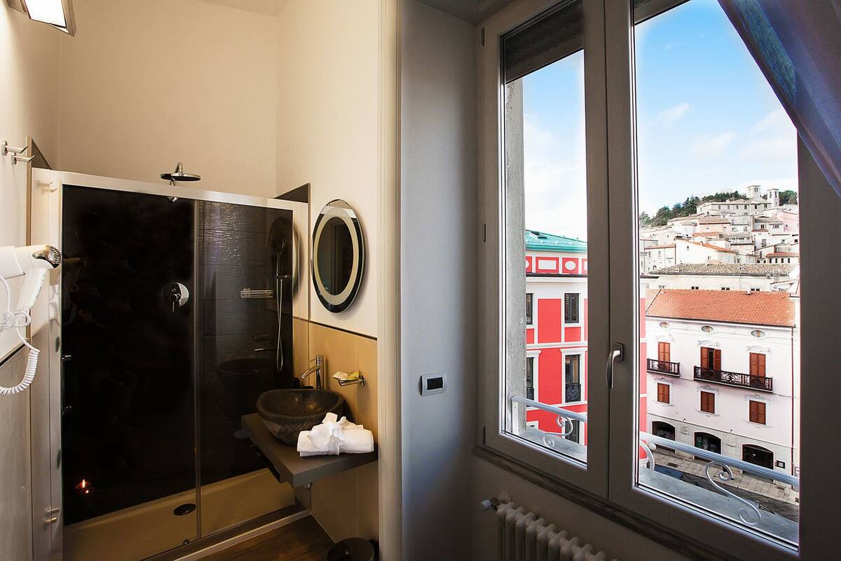suite (il teatro) | bathroom | shower, free toiletries, hair dryer, bathrobes