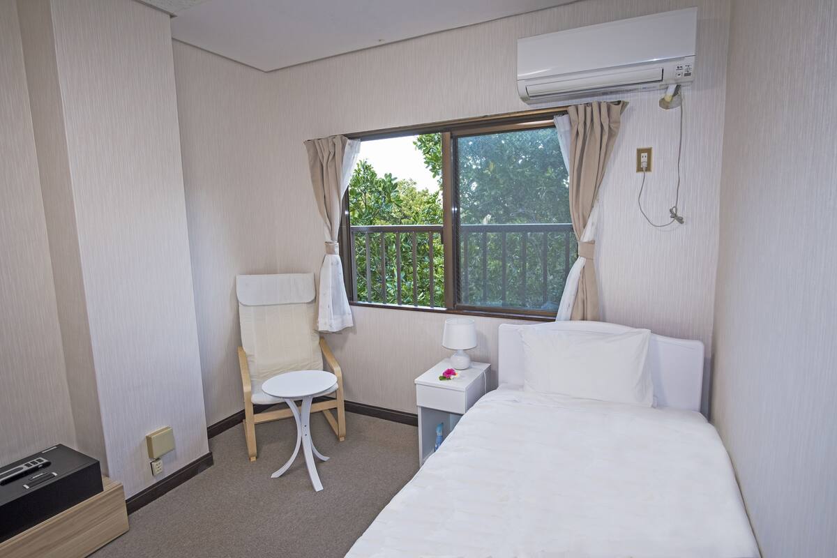 comfort single room, 1 single bed, non smoking, mountain view | in-room safe, desk, blackout curtains, iron/ironing board