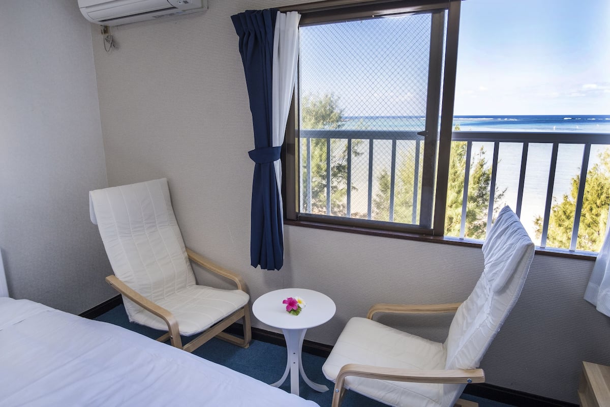 comfort twin room, 2 single beds, non smoking, sea view | in-room safe, desk, blackout curtains, iron/ironing board