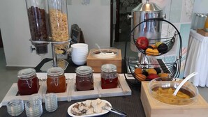 A breakfast buffet with various food items and beverages. - Hotel Rodon (Katerini)