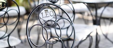A metal chair with a circular design and a cushion.